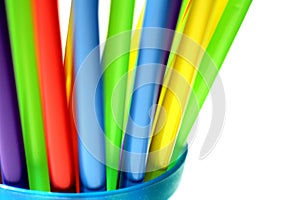Bright Colorful Plastic Straws in Blue Cup