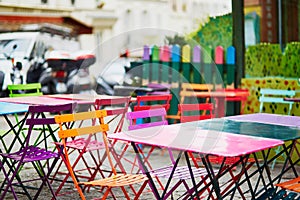 Bright colorful tables of Parisian outdoor cafe on Montmartre