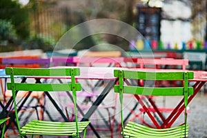 Bright colorful tables of Parisian outdoor cafe on Montmartre