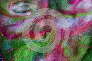 Bright colours of spinning wool roving.