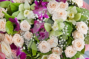 Bright composition of flowers. Bouquet of roses and orchids.