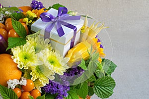 Bright composition of natural fruits, vegetables, flowers and greens