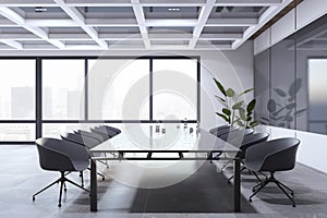 Bright conference room interior with furniture, concrete flooring and window and city view.