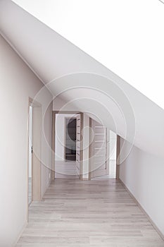 Bright corridor with beige doors