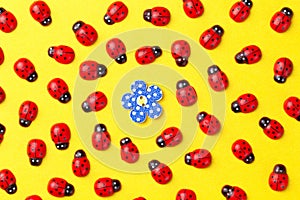 Bright creative background with decorative wooden button and ladybugs