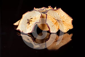 Bright, crispy, crisp snack of ripe and sweet apple on a black background