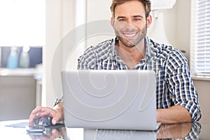 Bright cropped image of handsome young man smiling at camera