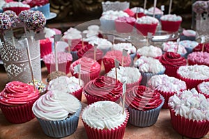 Bright cupcakes with pink and white frosting at a banquet