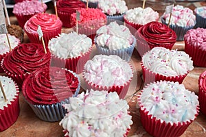 Bright cupcakes with pink and white frosting at a banquet