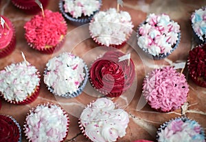 Bright cupcakes with pink and white frosting at a banquet