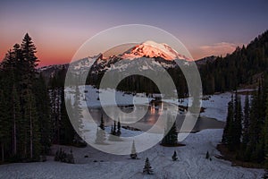 Bright dawn in snowy mountains photo