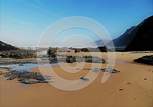 Blue Sky and Golden Sand at Praia do Castelejo photo