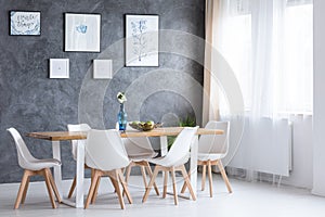Bright dining room with paintings