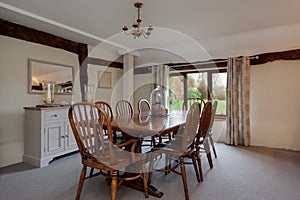 Bright dining room with wooden table and chairs