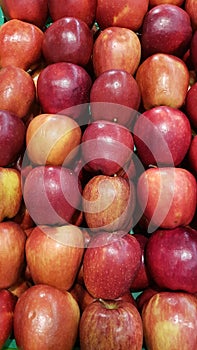 Bright display of fresh fruit in the market. group of red, healthy and sweet apples, suitable for the whole family, In a perfect