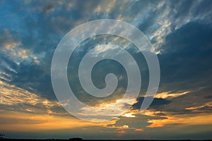 Bright dramatic sky with clouds at sunset