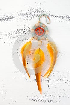 Bright dream catcher with an orange peace sign