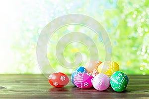 Bright early colored easter eggs on a sunny spring background