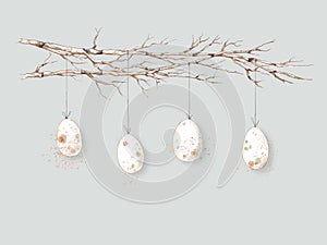 Bright Easter eggs with small spots hang on branches