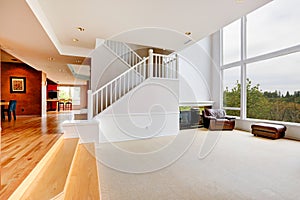 Bright empty house interior with large window