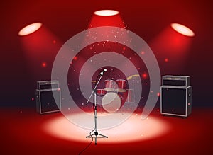 Bright empty scene with microphone, drum set and amplifiers in the light of spotlights photo
