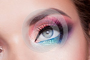 Bright eye makeup. Pink and blue color, colored eyeshadow.