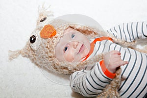 Bright Eyed Happy Baby in Owl Hat