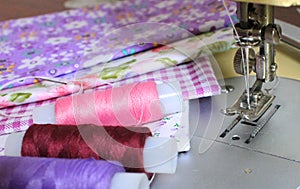 Bright fabrics, colorful spools of thread