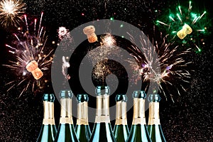 Bright festive fireworks in the sky from opening champagne bottles with flying corks, cheerful funny design for holiday banner