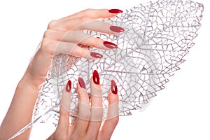 Bright festive red manicure on female hands. Nails design