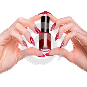 Bright festive red manicure on female hands. Nails design