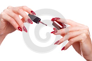 Bright festive red manicure on female hands. Nails design