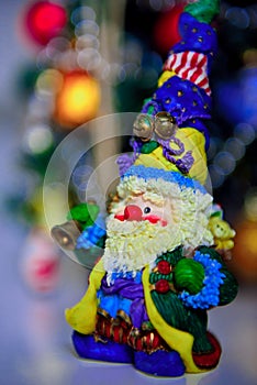 Bright figure of Santa Claus with a bell