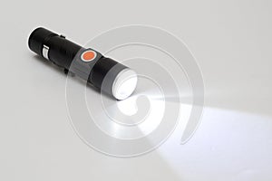 Bright flashlight on white background