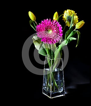 Bright flower bouquet in glass vase