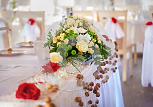 Bright flower bouquet on the wedding table