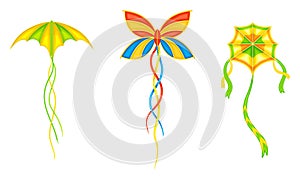Bright flying kites set. Festival kite of different shapes with ribbons, summer game toy cartoon vector illustration