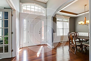 Bright Foyer with view of Dining Room and Parlor.