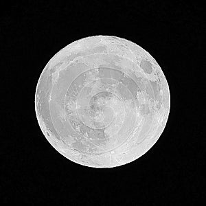 bright full moon and craters are seen in the black starless sky