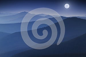 Bright Full  Moon Rises Over Hazy Colorado Rocky Mountain Range