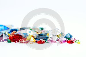 Bright gems on white background photo