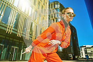 Bright girl in orange jumpsuit