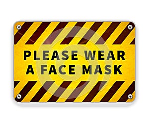 Bright glossy yellow and black metal plate, please wear a face mask, warning sign on white