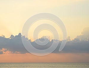 Bright Golden Sunrays through Clouds in Sky, Blue Sea Water and Horizon - Natural Background