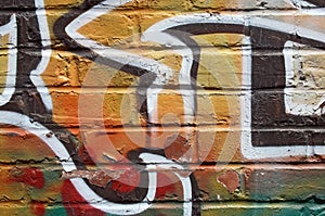 Bright graffiti on a peeling wall
