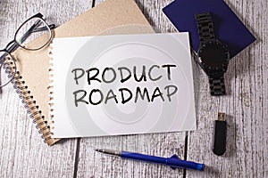 bright green background. notepad and stickers with text. PRODUCT ROADMAP