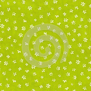 Bright green colored floral seamless pattern. Gouache painting small flowers on textured light green background.