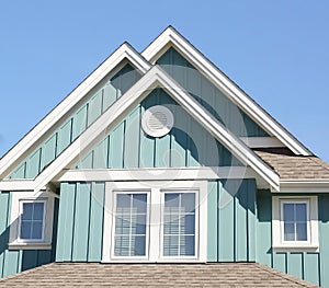 Bright Green House Home Exterior Roof Details