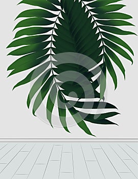 Bright green palm leaves on a gray