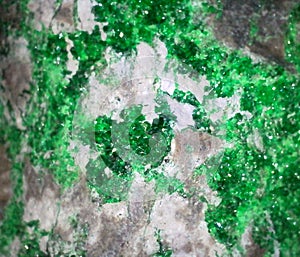 Bright green Uvarovite crystals on matrix